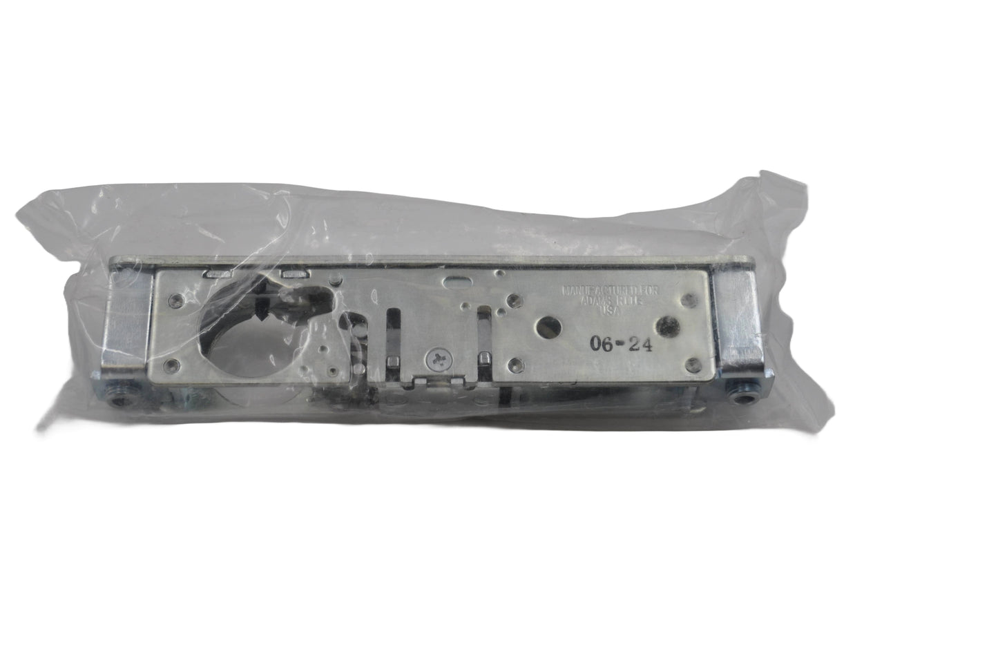 Top view of a Adams Rite 4720 Euro Dead Latch Case for aluminium doors, in clear packaging on a white background