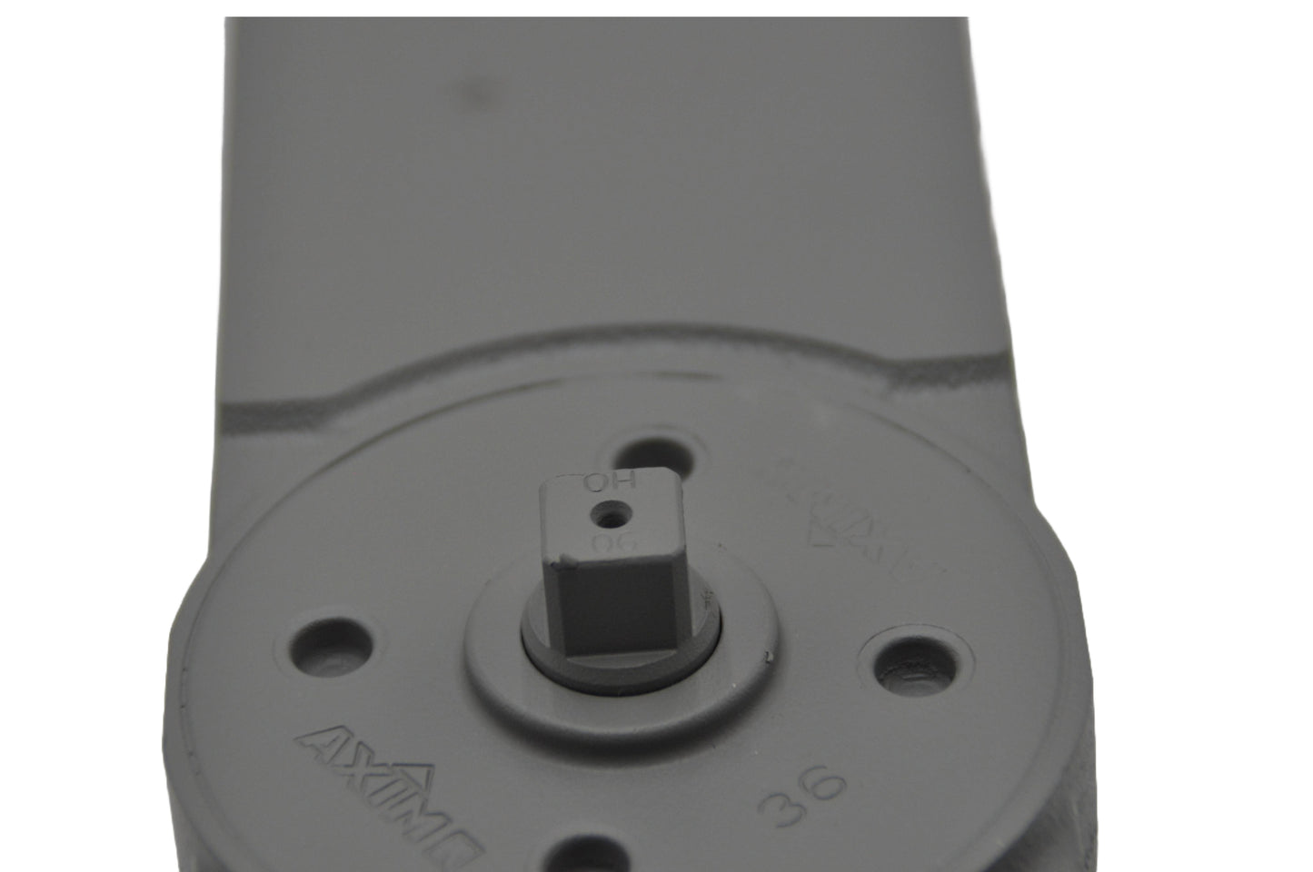 A close up view of a A concealed transom door closer, with its components partially visible, on a white background.