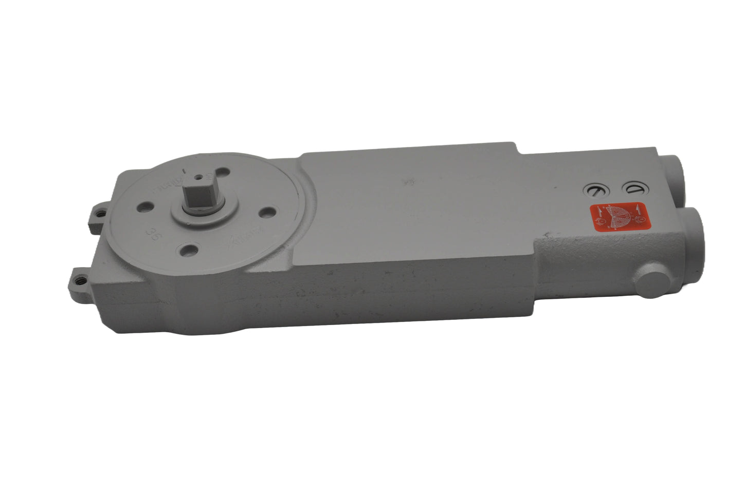 Top side view of A concealed transom door closer with red sticker, with its components partially visible, on a white background.
