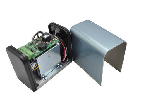 A view of a silver and black battery backup unit for an automatic door operator, showing the battery pack and wiring inside and a metal case on a white background.