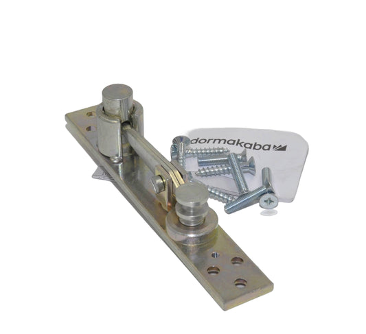 A view of a silver dormakaba 8066 top centre pivot for double action doors, with visible branding and components against a white background.