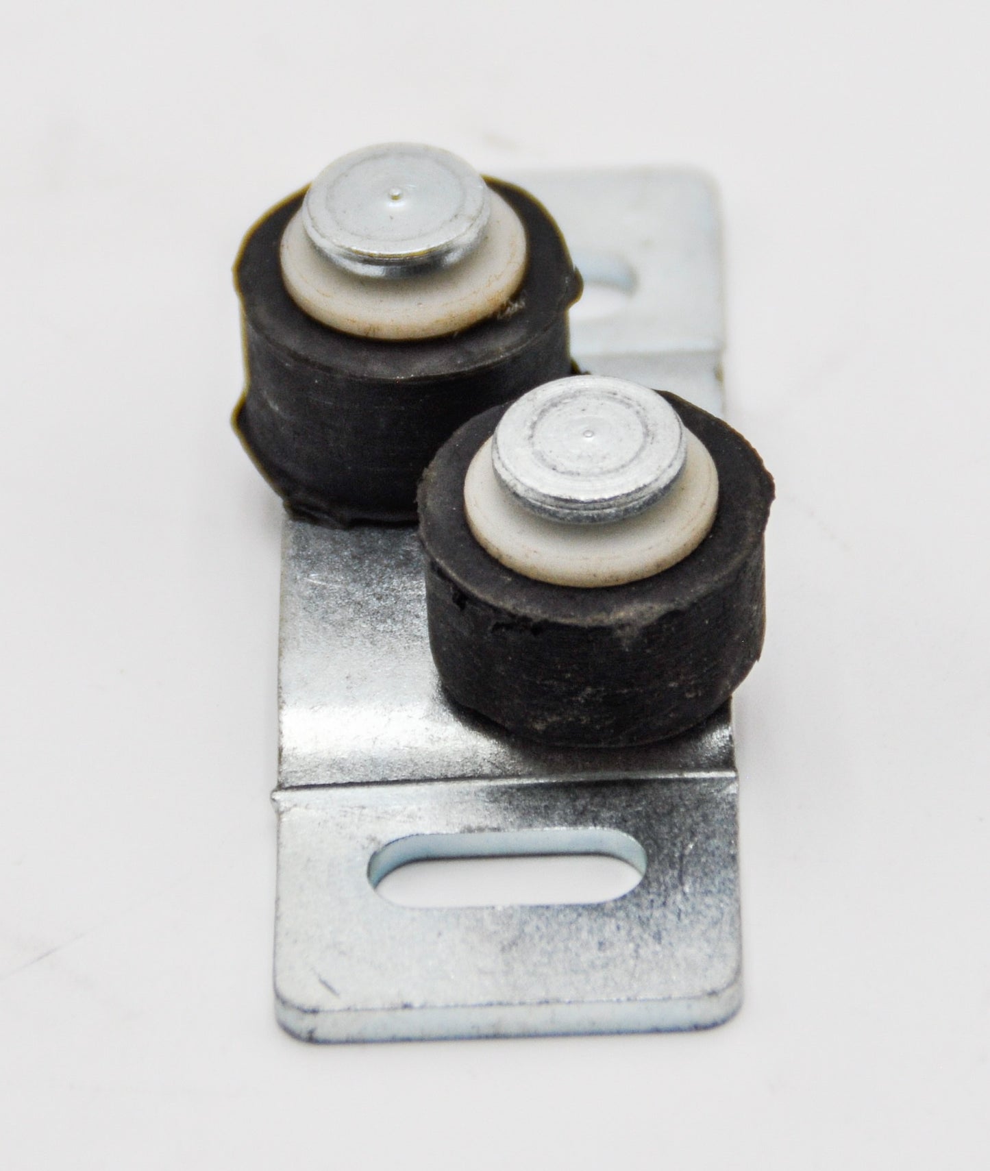 A top view of a double roller floor guide with black rubber rollers mounted on a metal plate. On a white background.