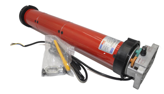A red tubular motor for roller shutters, with packaging and a manual override mechanism visible. On a white background.