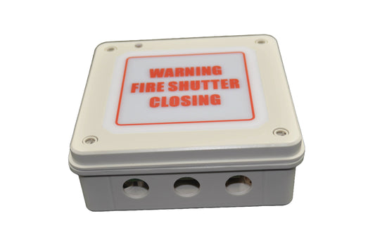 A top view of a Rectangular metal box with 'WARNING FIRE SHUTTER CLOSING' label on a white background