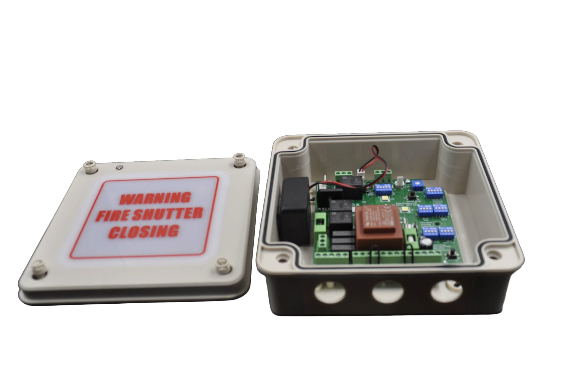 A view of a Fire shutter control panel with warning label open showing internal components, on a white background