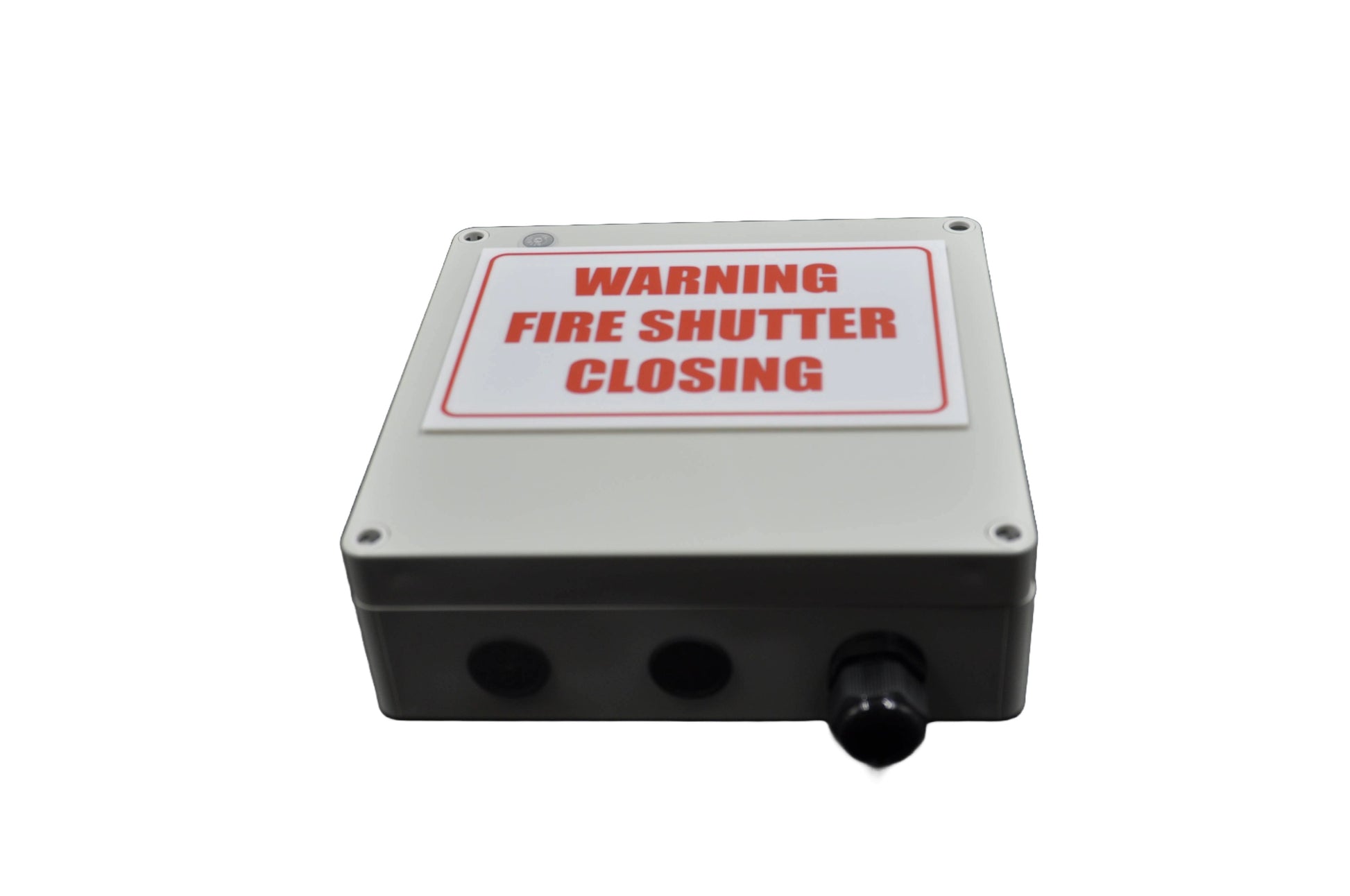 Fire shutter control box with white label with "warning fire shutter closing"in red on a white background