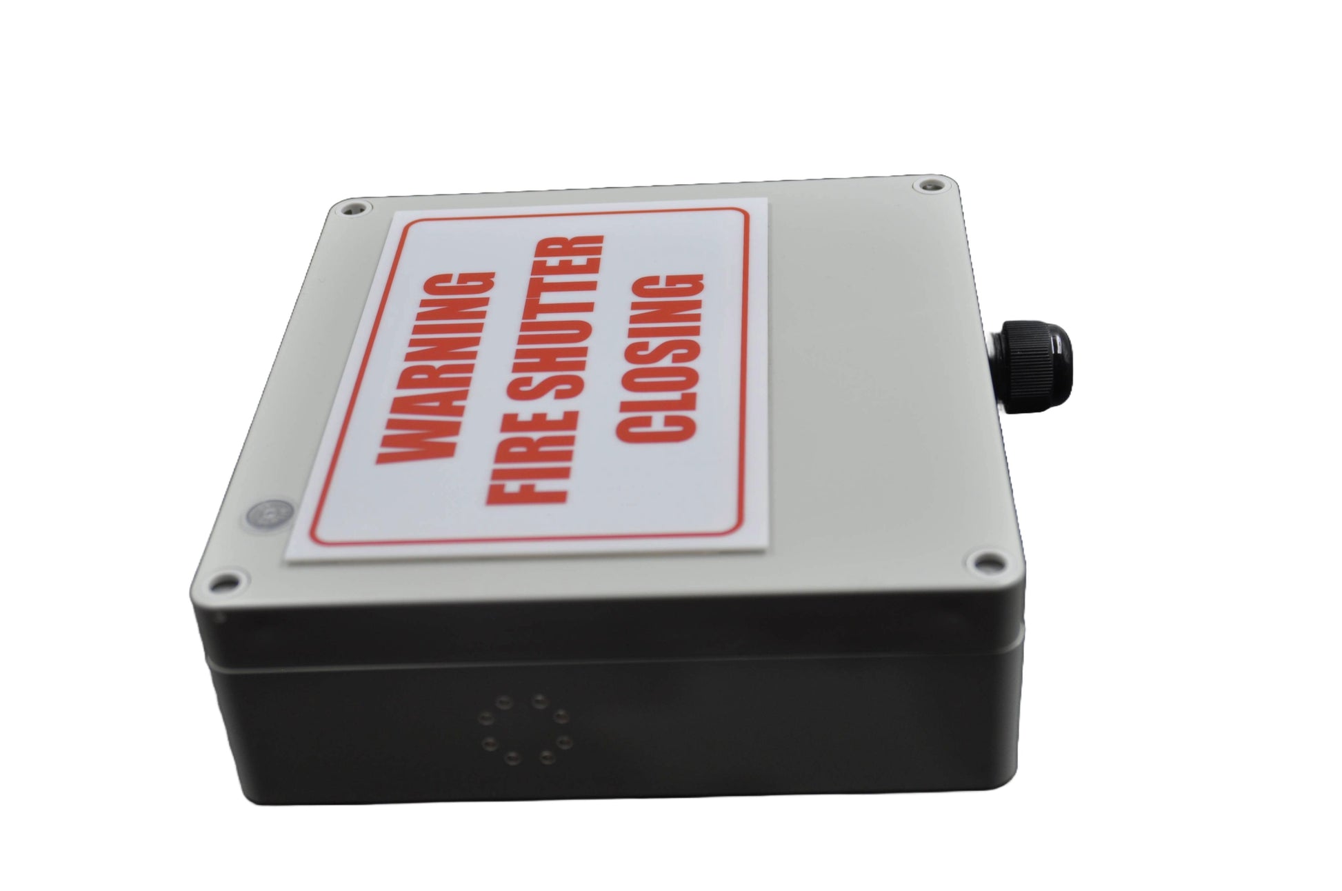 Fire shutter control box with white label with "warning fire shutter closing"in red on a white background