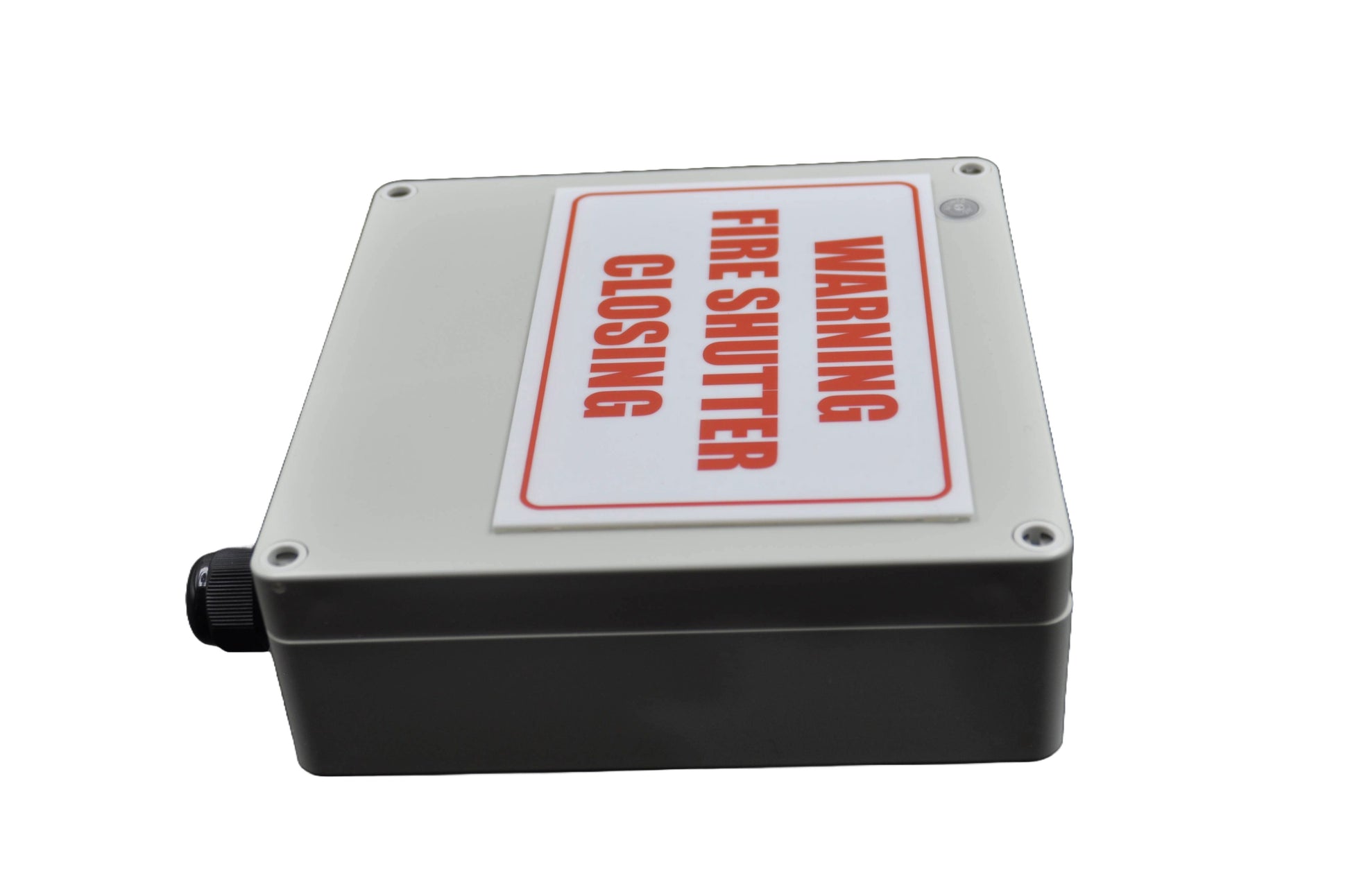 Fire shutter control box with white label with "warning fire shutter closing"in red on a white background