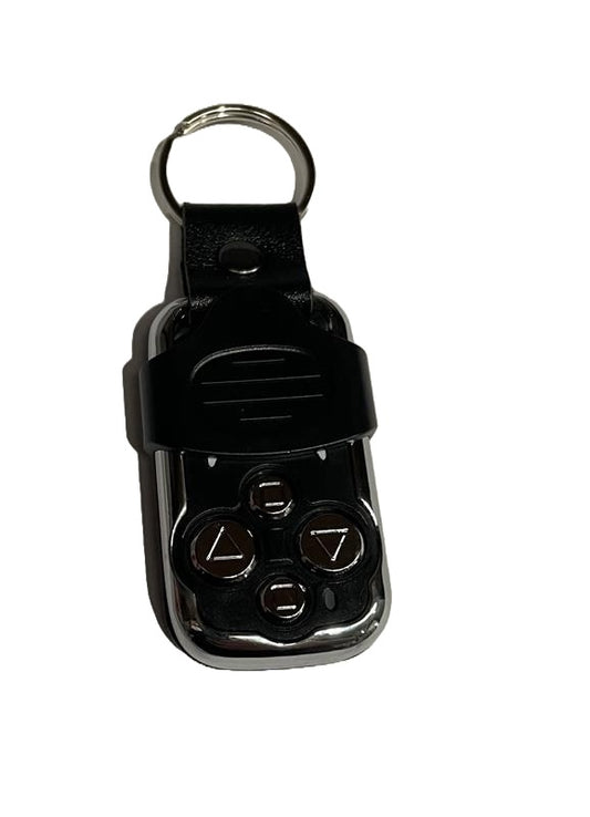 A black and silver Eurodrive remote control handset for electric roller shutter doors with a sliding cover protecting the buttons. On a white background.