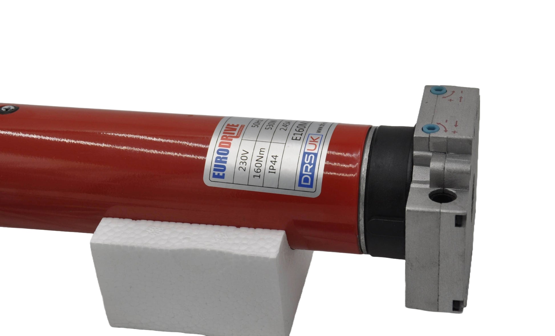 Part of a motor in red with a label in red , blue and grey, on a white background.