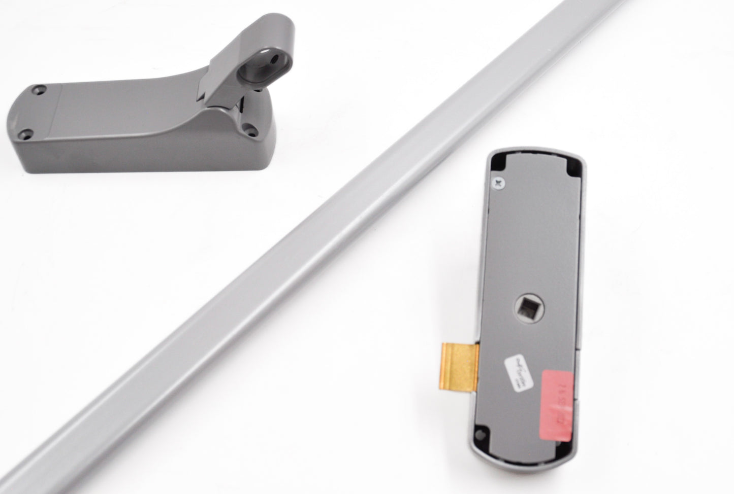 A silver Exidor single panic latch with a push bar, designed for emergency exit applications in buildings. On a white background.