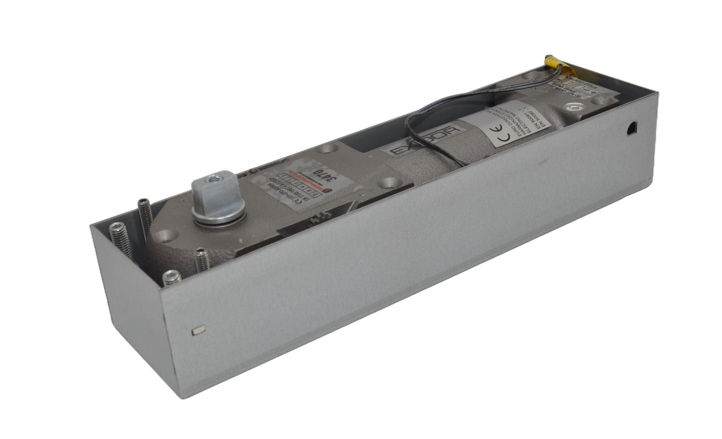 Exidor 3470 EMAG Floor Spring, an electromagnetic hold-open floor closer for heavy-duty doors, showing the mechanism within a metal housing box. On a white background.