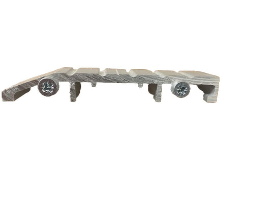 A view of a aluminium commercial door threshold plate with a low-profile design, featuring a smooth surface with mounted components at the base.  On a white background.
