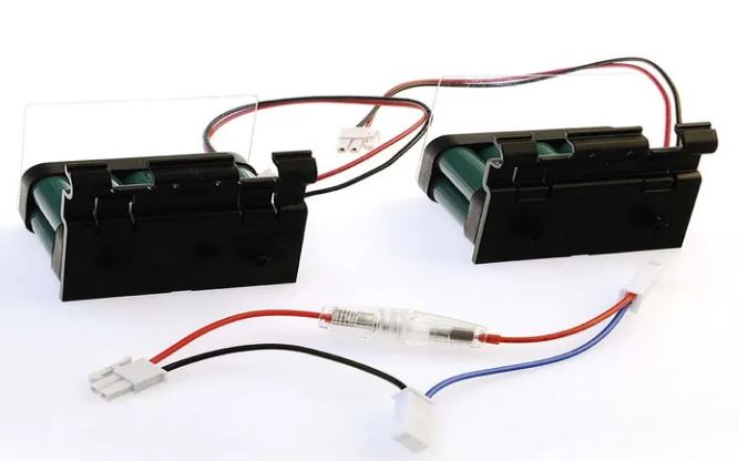 Two battery packs with Blue, Black and Red wires with connectors on a white background.