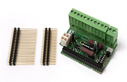 Assa Abloy - EXU-SA-board with green PCB, connectors, and pins on a white background