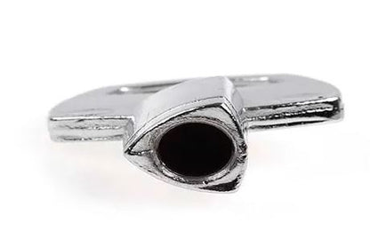 An Assa Abloy metal key with a round hollow end and flay key head, on a hite background.