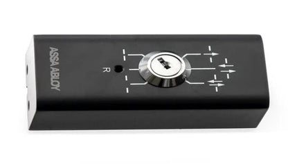 Assa Abloy - Program Selector PSK-6U, consisting of a Black electronic device with a dial and 'Assa abloy' branding on a white background