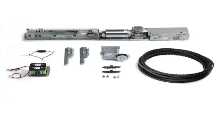 Assa Abloy - SL500 MUK for UniSlide in escape route consisting of a drive belt, battery pack, mechanical component and fixings, on a white background.