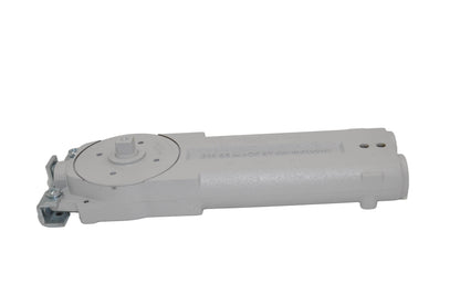 A view of a dormakaba RTS85 Transom Door Closer predominantly grey in colour. On a white background.